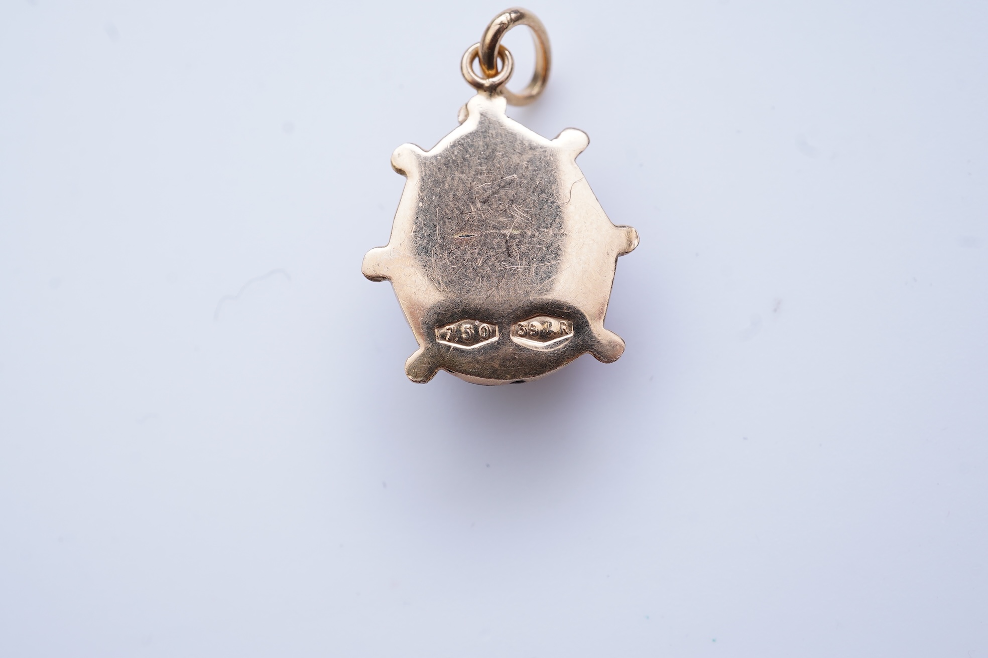A gold and enamel pendant, Italy, 1960s